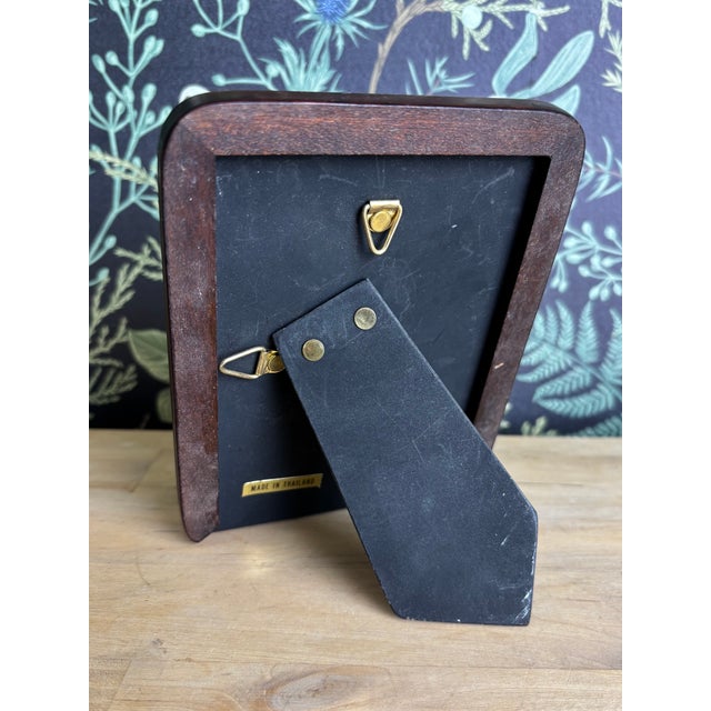 A tender miniature watercolor depicting a calico kitten taking a curious step forward. Soft washes and subtle color...