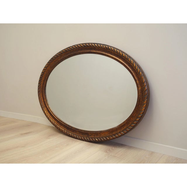 The mirror was made in the 1960s, Danish production. The frame of the mirror is made of solid wood. The frame has been...