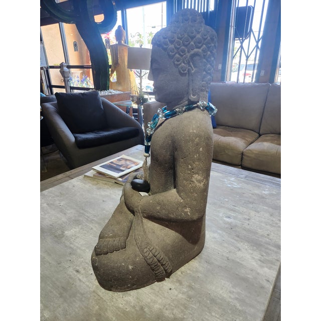 Invite a sense of serenity and sculptural presence into your space with this striking Indonesian-style lava-stone Buddha...
