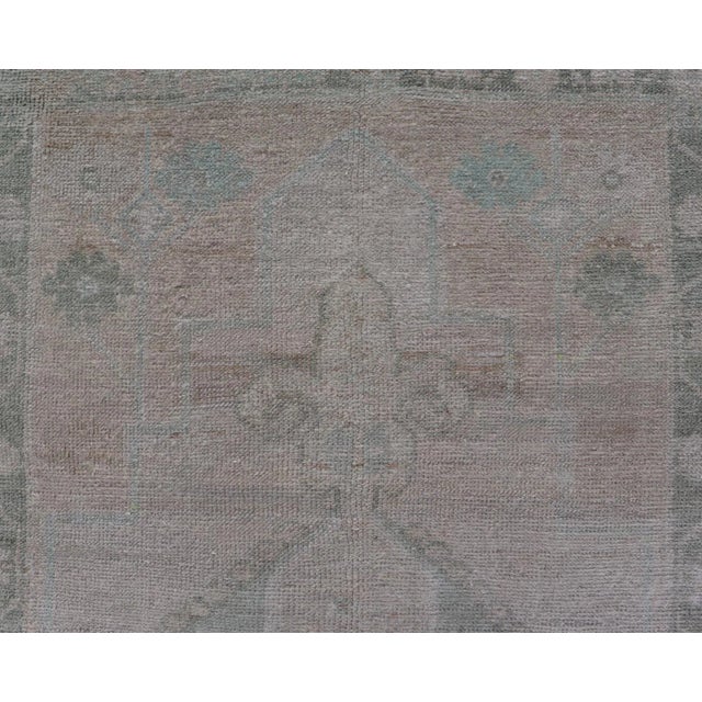 Measures: 2'9 x 6'6 Vintage Turkish short Oushak Runner with Subdued Geometric Medallions in Light Tones Vintage small...