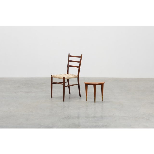 A refined and sculptural piece of mid‑century Italian design, this small table, stamped “Italia”, beautifully reflects the...