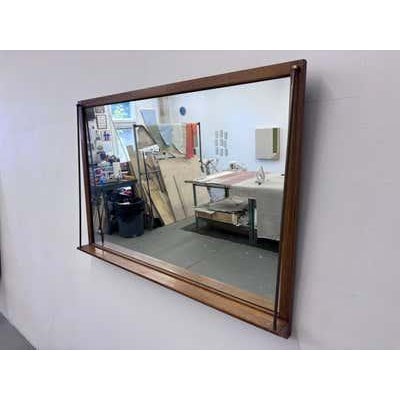 Large Drexel wall mirror with bottom ledge and brass trim. Unique design that I have not seen before! Came with a complete...