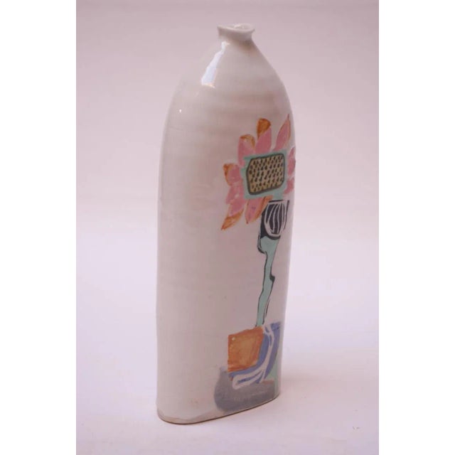Tall 1976 Pollack vase / vessel in a white high-gloss glaze with colorful, hand painted floral decoration. Signed "Pollack...