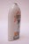 Tall 1976 Pollack vase / vessel in a white high-gloss glaze with colorful, hand painted floral decoration. Signed "Pollack...
