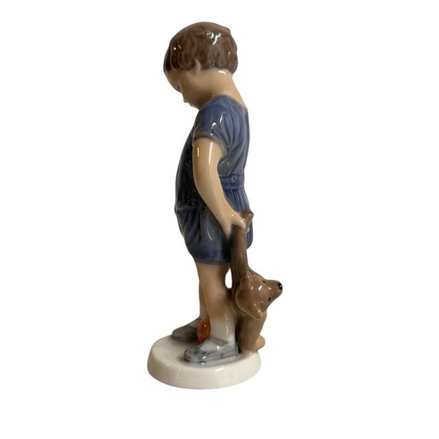 Royal Copenhagen Ceramic Figurine, Child with Kitten, 20th Century Hand-decorated ceramic figurine, Royal Copenhagen mark...