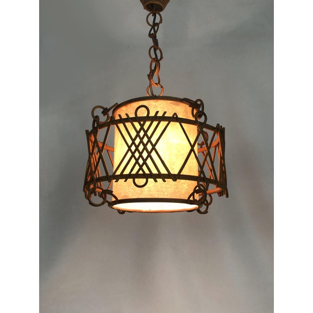 Rattan pendant light, Louis Sognot style. 1950s Rattan and bamboo pendant light in the Louis Sognot style. It will add a...