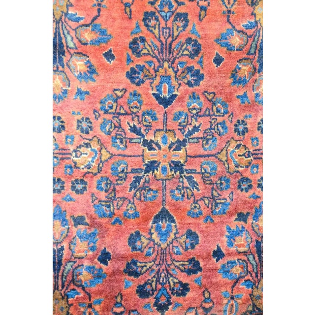 A beautiful late 19th century Persian Kashan rug with a wonderful mirrored floral pattern depicting vases potted with...