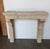 This petite French limestone mantel embodies the quiet refinement of 18th-century provincial architecture, scaled...