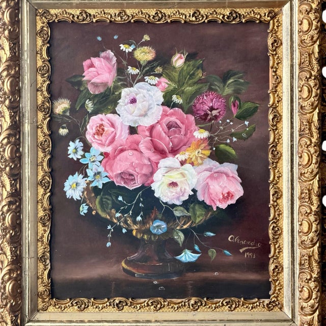 Signed floral still life painting (1993) featuring roses and mixed blooms, housed in an elaborate gilt frame with heavy...
