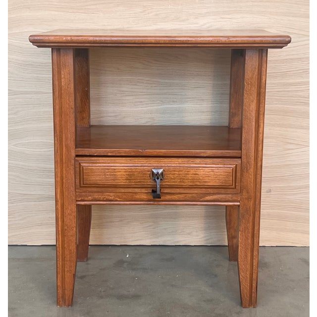 20th century Pair of solid carved Spanish nightstands with one low carved drawer with original bronze pull. Dimensions:...