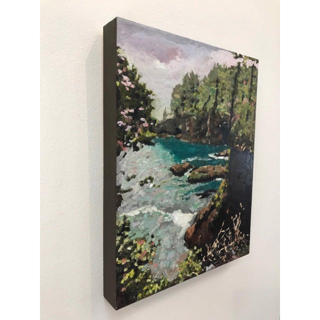 This artwork depicts a serene coastal landscape, where vibrant turquoise waters gently lap against rocky shores, framed by...