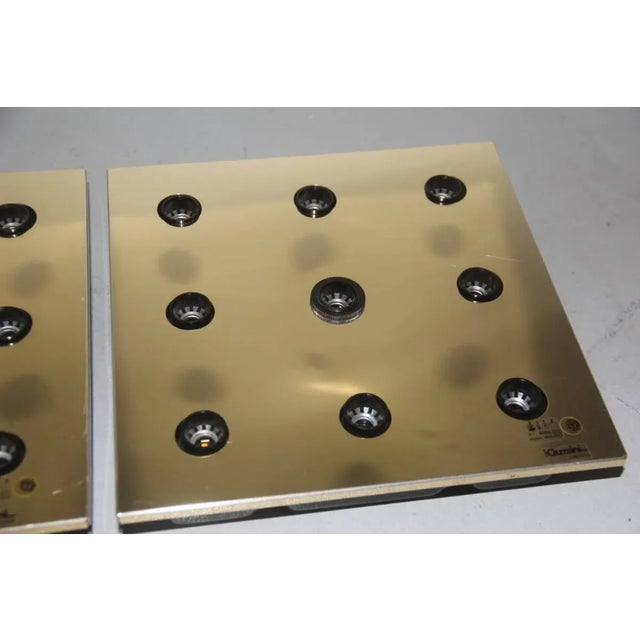 This pair of golden-colored metal ceiling lamps was produced by Guzzini. Up to 250V (Europe/UK Standard).The wiring of...