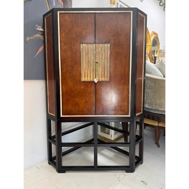 Therien Workshops for Dessin Fournir Cocktail Dry Bar Cabinet. The interior is lined with mirrors and includes two thick...