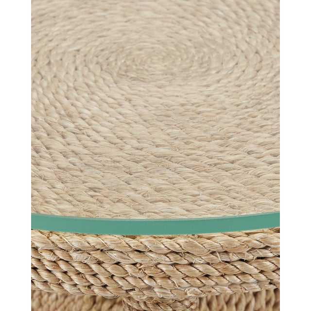 The wrought iron and wood frame of the Limay Rope Drinks Table is wrapped in natural Abaca rope. The precision with which...
