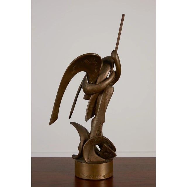 An Interlocking Bronze Sculpture of St. Michel by Belgian artist Olivier Strebelle. It was created as an award for the...