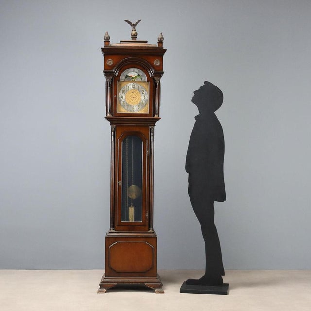 The WALT painted wood pendulum clock is a refined example of 20th-century German craftsmanship. The wooden structure is...