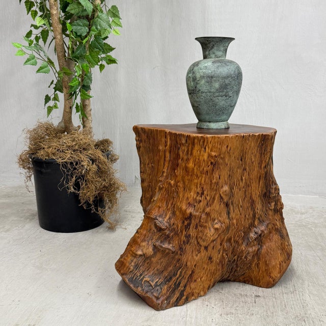 "About This Piece About This Piece Alive with the warmth of amber tones and deep, organic texture, this solid burlwood...