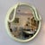 A spectacular 1980's cream colored two headed circular swan mirror. This is a large, impressive piece constructed from...