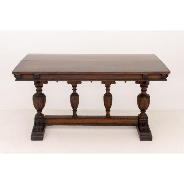 Jacobean Style Oak Refectory Table, with removable and extending leaf on urn form and foliate carved base. 30.5" H x 60" W...
