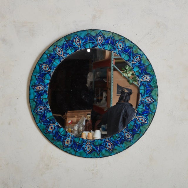 A Scandinavian Modern round wall mirror by Bodil Hagedorn Eje. Daughter of painter Thorvald Hagedorn-Olse, Bodil Eje was a...