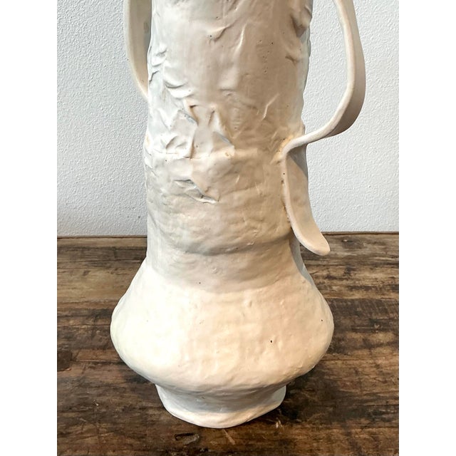 This striking vintage studio pottery vase is a masterclass in organic modernism and sculptural form. Characterized by its...