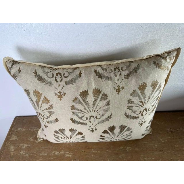 Decorative pillow made from an authentic Nomi Design stenciled linen, featuring a classic European-inspired motif in warm,...