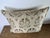 Decorative pillow made from an authentic Nomi Design stenciled linen, featuring a classic European-inspired motif in warm,...