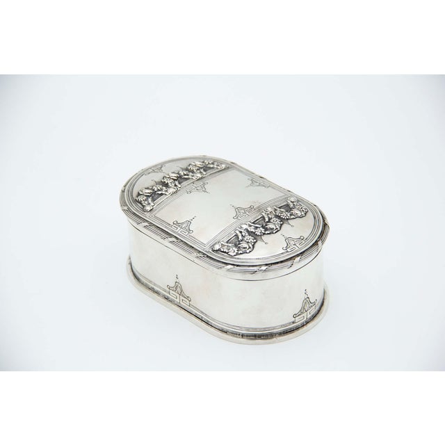Elliptical Silver Soap Dish with Floral Reliefs, in Very Good conditions. Designed 1890 to 1919 This piece has an...