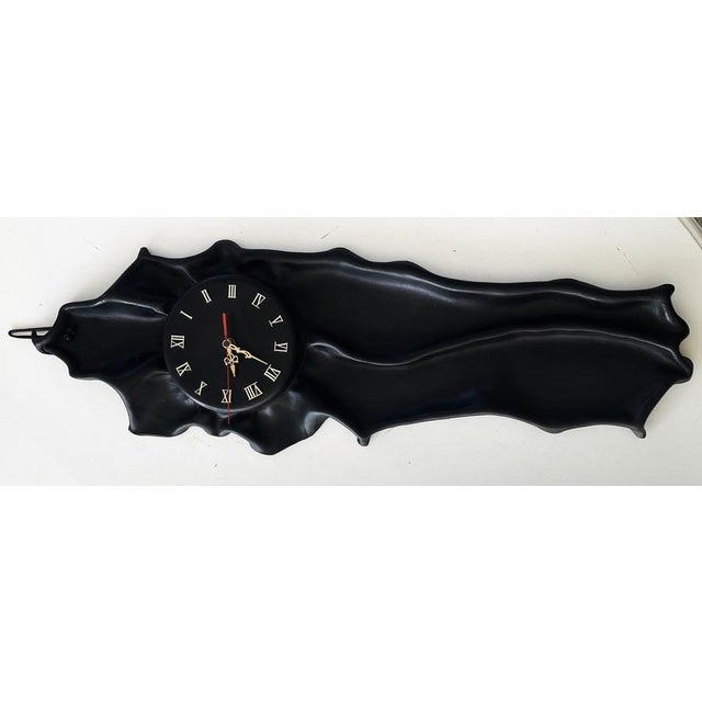 A large wall clock made of leather molded into a decorative motif. This is no ordinary clock – it's an eye-catching wall...