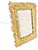 Vintage Hollywood Regency picture frame featuring a sculptural gilt feather motif with rich gold tone and dimensional...