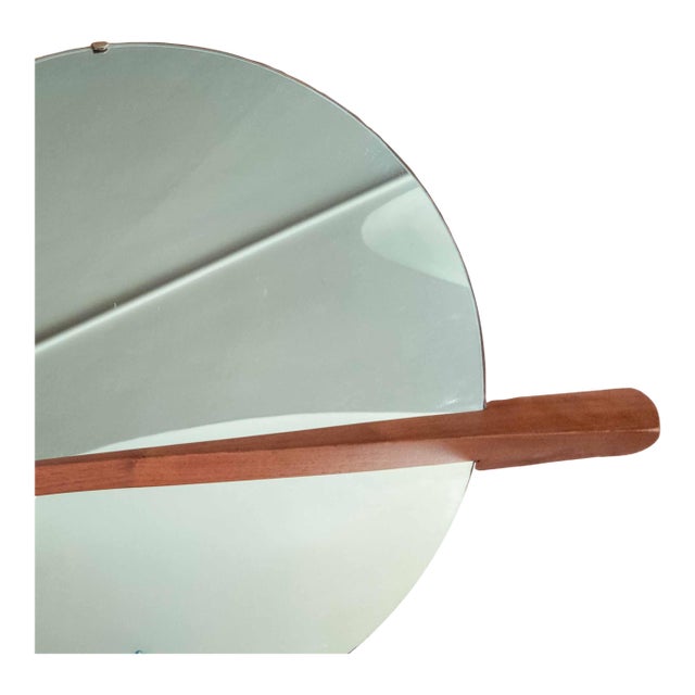 We are selling this great Mid-Century modern wall mirror. This wall mirror has simple and elegant design, central round...
