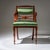 Biedermeier armchair raised on front baluster legs and slightly curved rear legs. The armrests terminate in volutes and...