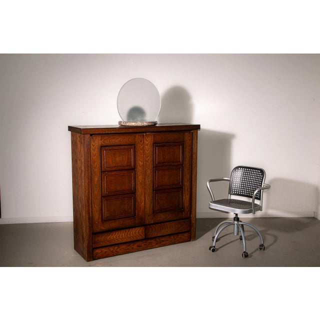 Bar cabinet with sculptural carvings made from Oak in the 1970’s. In good condition with signs of consistent with age....