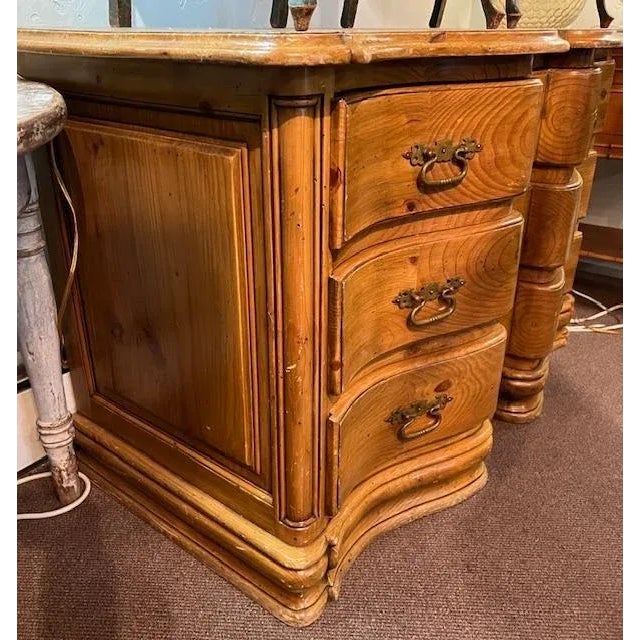 A late 19th century serpentine chest of drawers — a well-made, heavy, sturdy piece with a graceful curved front. Elegant...