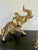 Here is a delightful organizing piece from the mid-century featuring a gold-finished metal elephant on a painted black...