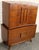 Elegant mid-century modern walnut highboy dresser featuring five drawers with beautifully figured burl wood handles....