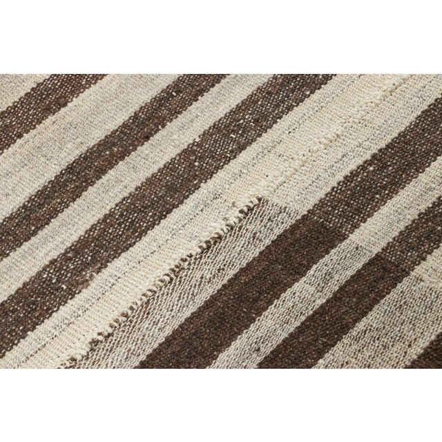 This vintage 4x6 Persian kilim is a mid-century Qashqai tribal rug, handwoven in wool circa 1950-1960. On the Design: This...