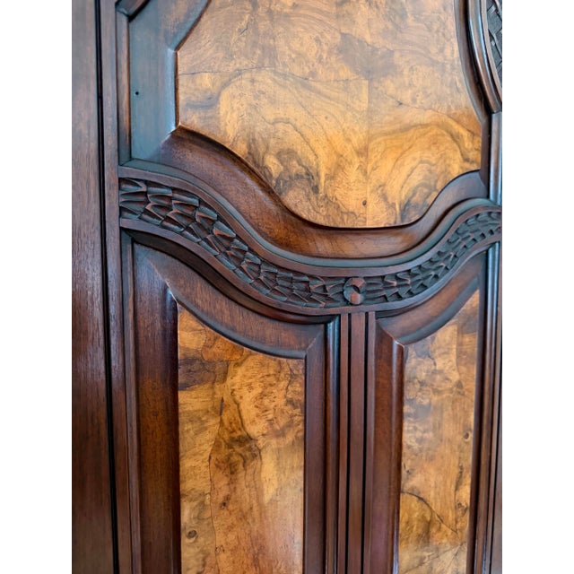 This unique piece features beautiful walnut burl panels, exquisite detail work and original features such as a back panel...