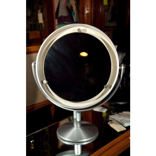 Large brushed steel standing round mirror from French department store.