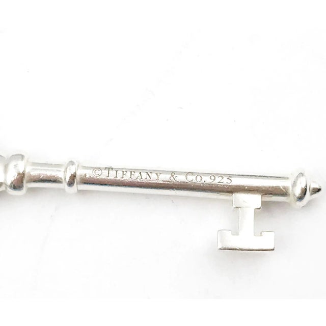 Tiffany & co 925 Silver Large Daisy Key Pendant with Diamond Necklace *Marked Tiffany & Co and 925 *With 1 diamond *Comes...