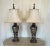 Beautiful unique pair of lamps with original shades. Very heavy solid lamps with ornate brass trim and matching finials....