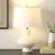 Illuminate your space with the Jola 23 inch ceramic table lamp in a sophisticated off white finish. This lamp adds an...