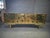 This stunning brass and black glass sideboard with 24 green jewels is a masterpiece of Italian craftsmanship that embodies...
