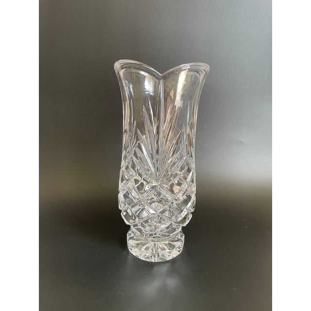 A vintage cut crystal vase showcasing a timeless criss-cross diamond pattern, complemented by fan designs. Very nice...