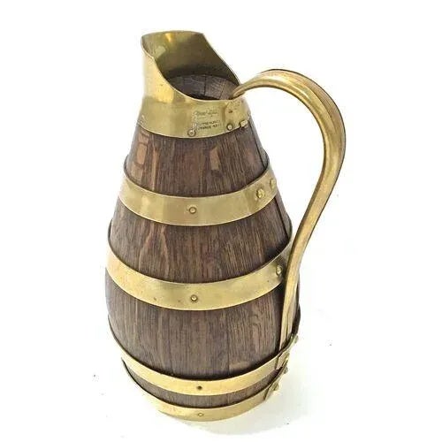 Antique French oak and brass miniature wine keg with handle. Marked "Géraud-Fafitie, Milleur Olvrier De France, 1933" on...