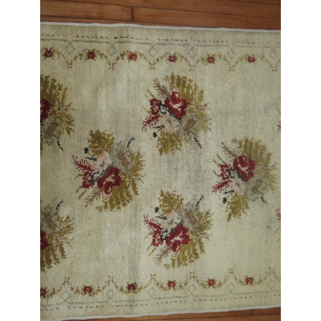 1940s Turkish Runner with a flower design on an ivory ground Measures: 3'8'' x 8'10''.