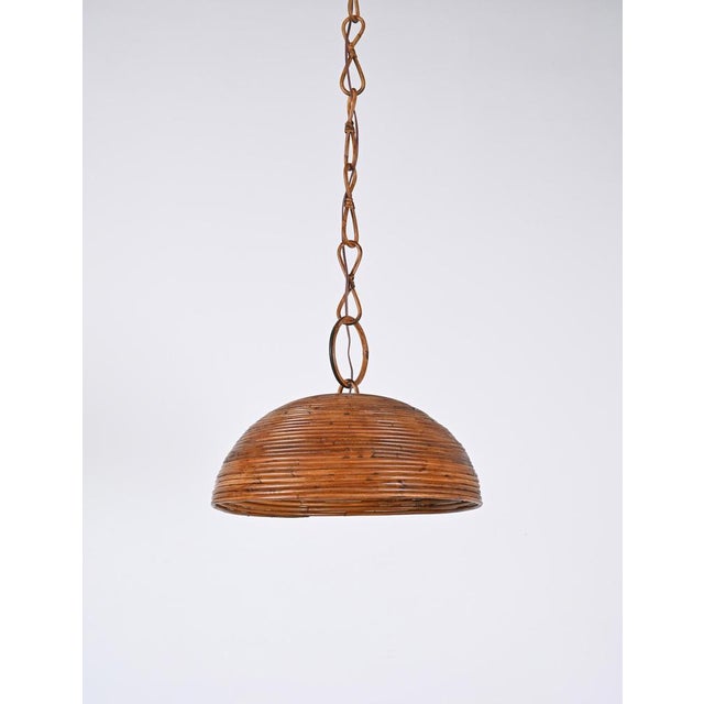 Wonderful midcentury bamboo, rattan circular pendant in French Riviera style, produced in Italy during the 1960s. The...
