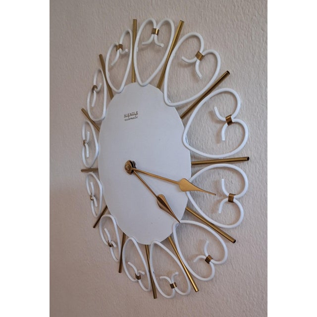 Vintage Wall Clock with White Metal Case with Brass Rays and Hands by Kienzle, 1970s, in Very Good conditions. Designed...