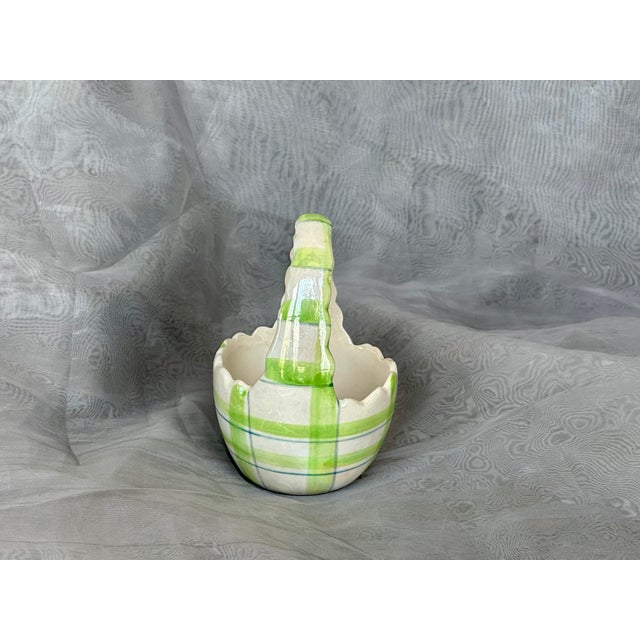 Fill this small decorative ceramic egg basket with Easter candy and display it on a living room side or coffee table. The...