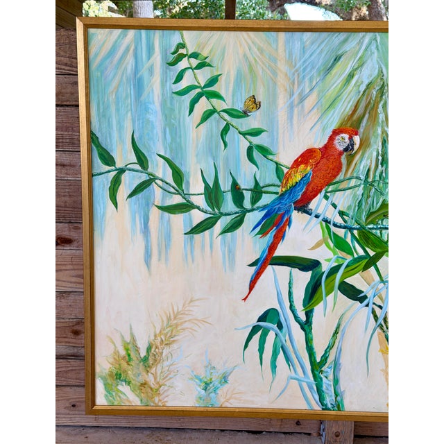 A truly monumental vintage tropical oil on canvas depicting two brilliantly colored macaws nestled among lush botanical...